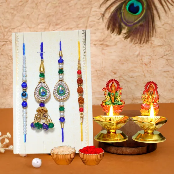 Chhariya_Crafts_Designer_Bhaiya_Bhabhi_Rakhi_Combo_Gift_Set_Assorted,_Gold_Finish,_Jute,_Pearl,_Plastic_(PVC),_Zardosi_Rakhi,_Showpiece,_Lumba,_Chawal_Roli_Pack__Set_(2_Metal_Diya,_1_Chawal_Roli_Pack,_1_Designer_Lumba,_3_Designer_Rakhi)