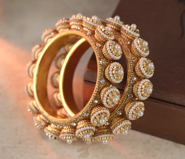 Golden_Alloy_With_Pearl_Studded_Bangles_For_Women_Set_Of_2