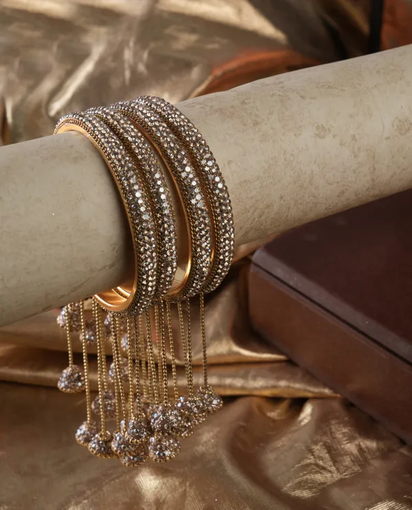 Golden_Alloy_With_Stones_And_Chains_Charm_Hanging_Bangles_For_Women_Set_Of_2