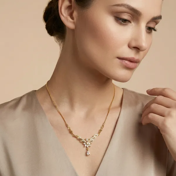 Elegant_Gold_Plated_Floral_Necklace_With_Crystal_Accents