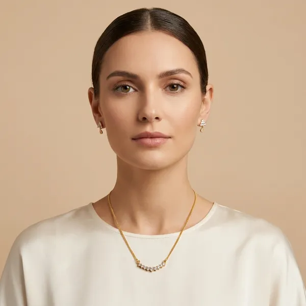 Elegant_Gold_Toned_Necklace_Set_With_Crystal_Embellishments