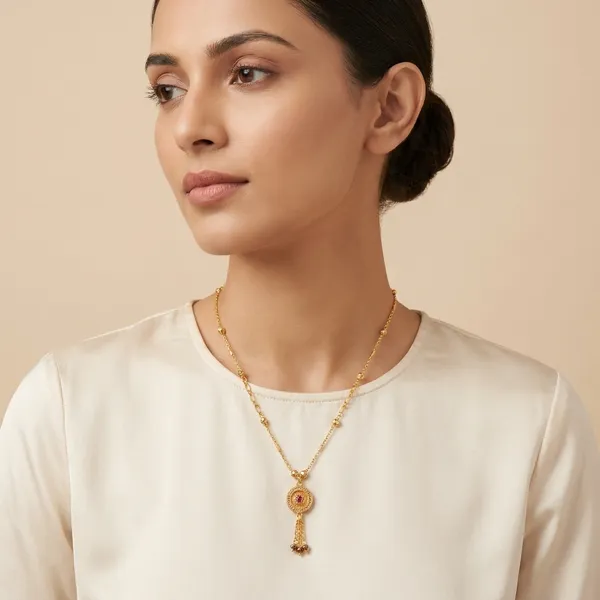 Gold_Toned_Chain_Necklace_With_Decorative_Pendant