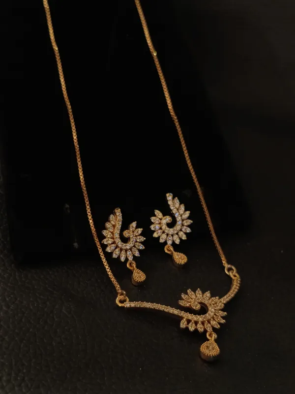 Gold_Toned_American_Diamond_Necklace_Set_With_Floral_Design