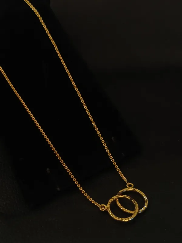 Elegant_Dual_Circle_Twisted_Pendant_Necklace_In_Gold_Tone
