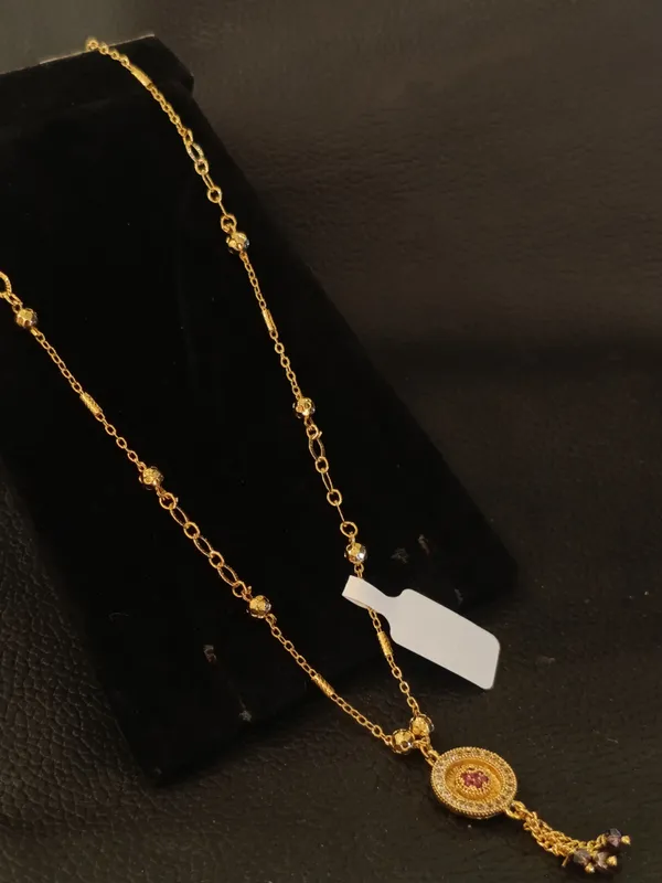 Gold_Tone_Chain_Necklace_With_Circular_Pendant_And_Pearl_Drop