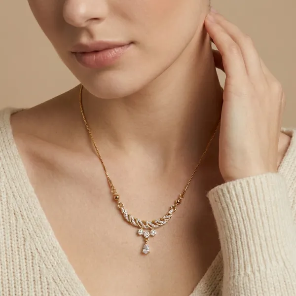 Elegant_Gold_Toned_Necklace_With_Curved_Pendant_And_Crystal_Drop
