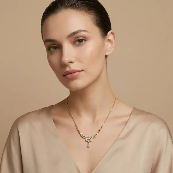 Elegant_Gold_Toned_Necklace_With_Curved_Pendant_And_Crystal_Drop