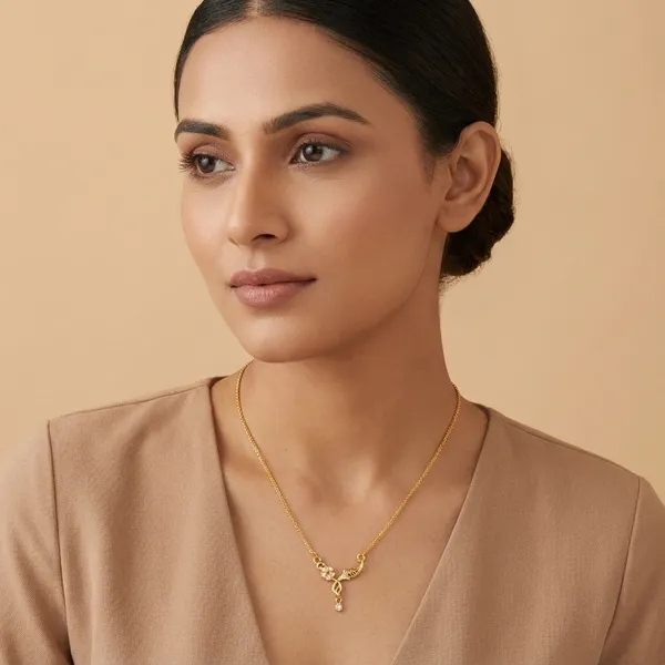 Elegant_Gold_Toned_Floral_Pendant_Necklace_With_Crystal_Embellishments