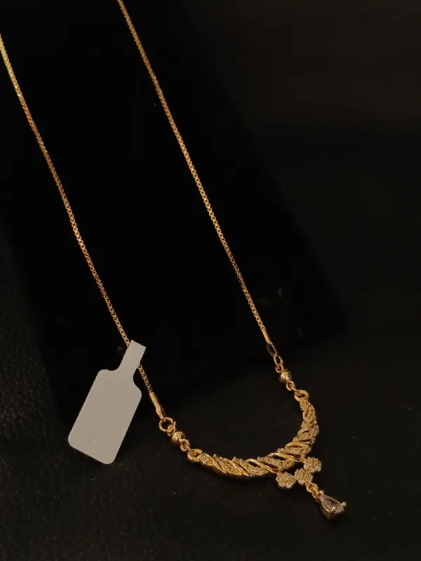 Elegant_Gold_Toned_Crescent_Moon_Necklace_With_Crystal_Accents
