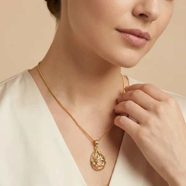 Elegant_Gold_Toned_Teardrop_Pendant_Necklace_With_Intricate_Filigree_Design