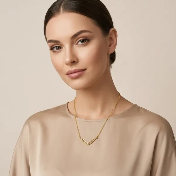 Elegant_Gold_Toned_Necklace_With_Intricate_Cutwork_Pendant