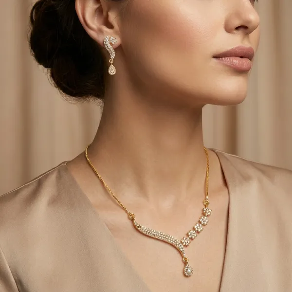 Elegant_Golden_Leaf_Necklace_And_Earring_Set_With_Crystal_Embellishments