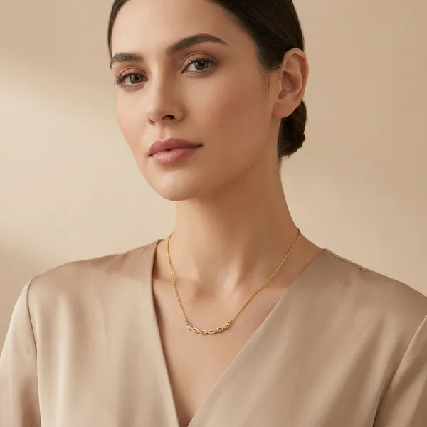 Elegant_Gold_Toned_Twisted_Chain_Necklace_With_Delicate_Pendant