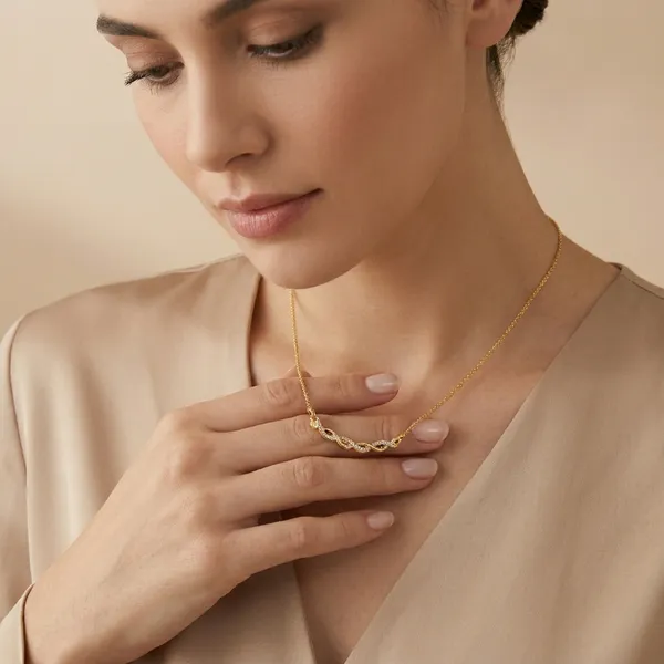 Elegant_Gold_Toned_Twisted_Chain_Necklace_With_Delicate_Pendant
