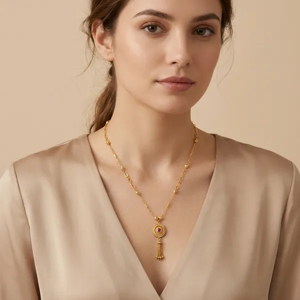 Gold_Tone_Chain_Necklace_With_Circular_Pendant_And_Pearl_Drop