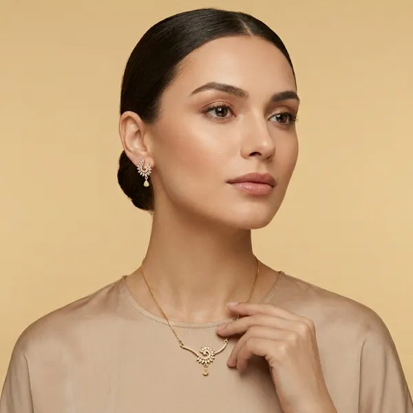 Elegant_Golden_Leaf_Necklace_And_Earring_Set_With_Sparkling_Stones