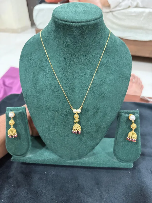 Gold_Jhumka_Pendant_Necklace_Set_with_Pearl_&_Ruby_Drops