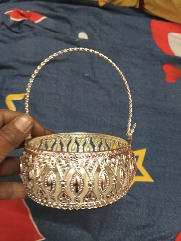 Decorative_Gold-Toned_Metal_Basket_With_Intricate_Cutout_Design