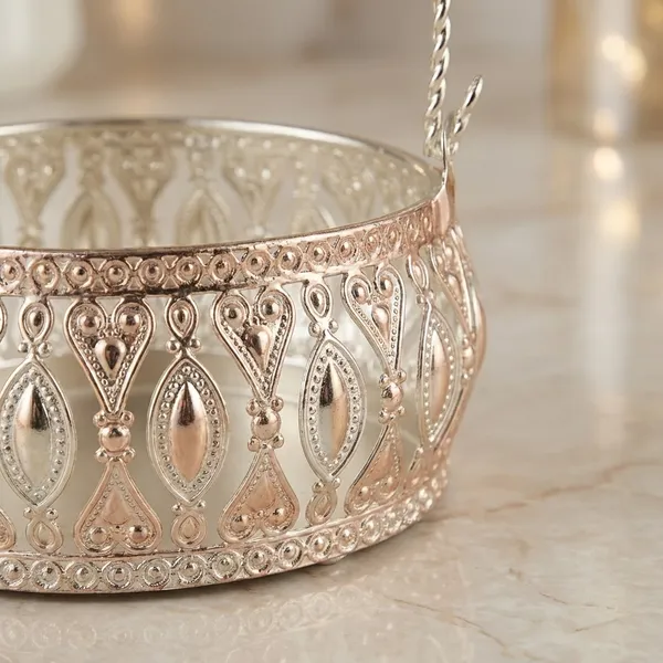Decorative_Gold-Toned_Metal_Basket_With_Intricate_Cutout_Design