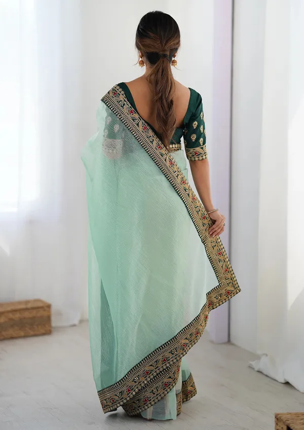 Shimmer_Net_Traditional_Motif_Embroidered_Saree_With_Blouse_Piece