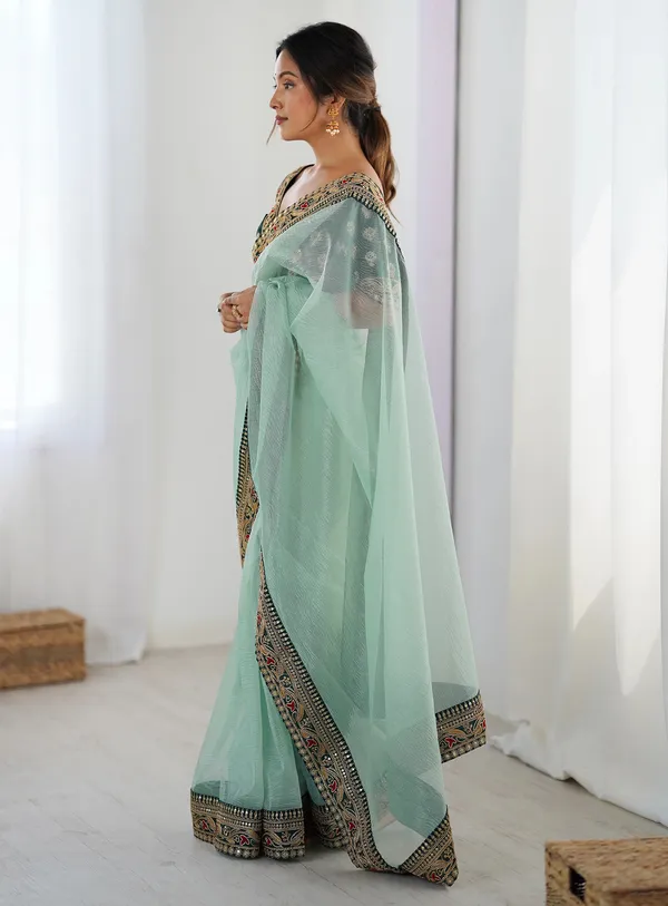 Shimmer_Net_Traditional_Motif_Embroidered_Saree_With_Blouse_Piece