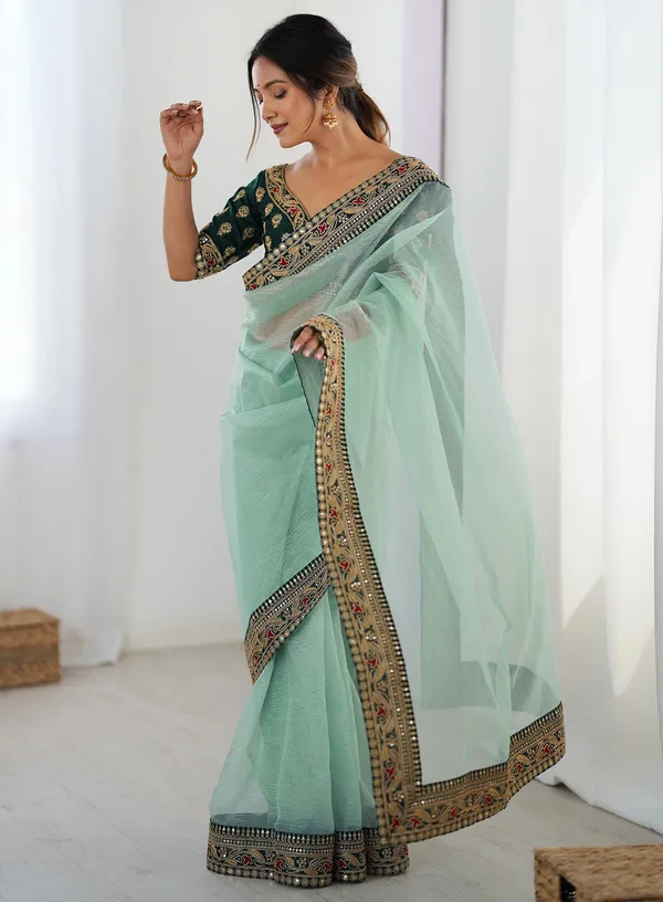Shimmer_Net_Traditional_Motif_Embroidered_Saree_With_Blouse_Piece