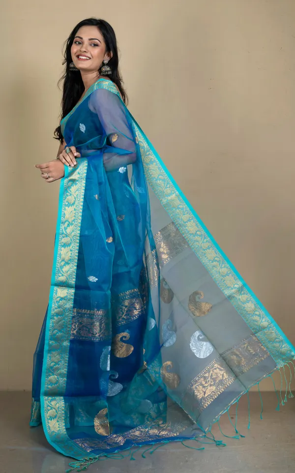 Soft_Muslin_Silk_Banarasi_Saree_In_Peacock_Blue_Baby_Blue_Golden_And_Silver_Zari_Work