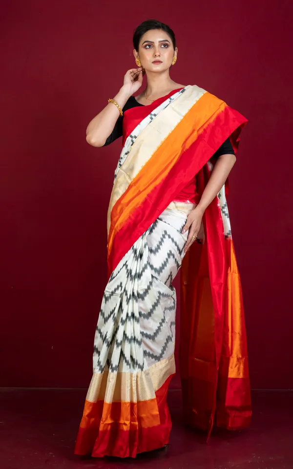 Designer_Skirt_Border_Ikkat_Pochampally_Silk_Saree_In_Off_White_Red_Fire_Orange_Black_And_Antique_Golden