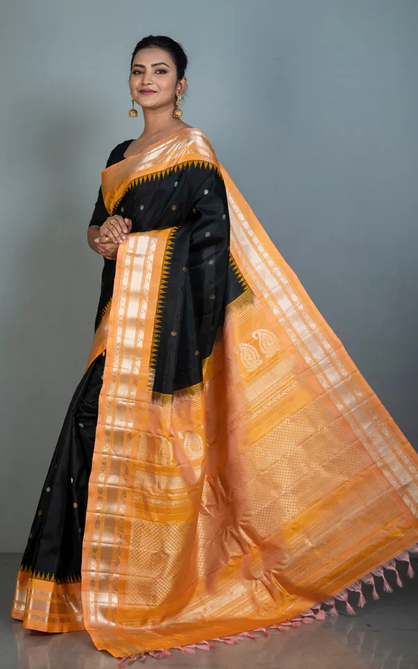 Hand_Woven_Exclusive_Kuttu_Gadwal_Silk_Saree_In_Black_Apricot_With_Silver_And_Golden_Zari_Work