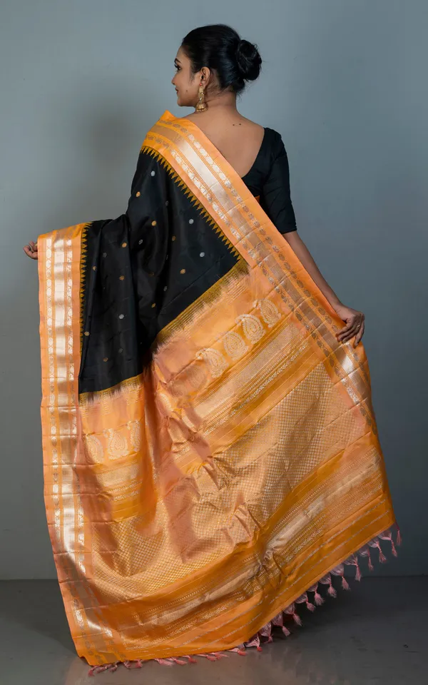 Hand_Woven_Exclusive_Kuttu_Gadwal_Silk_Saree_In_Black_Apricot_With_Silver_And_Golden_Zari_Work