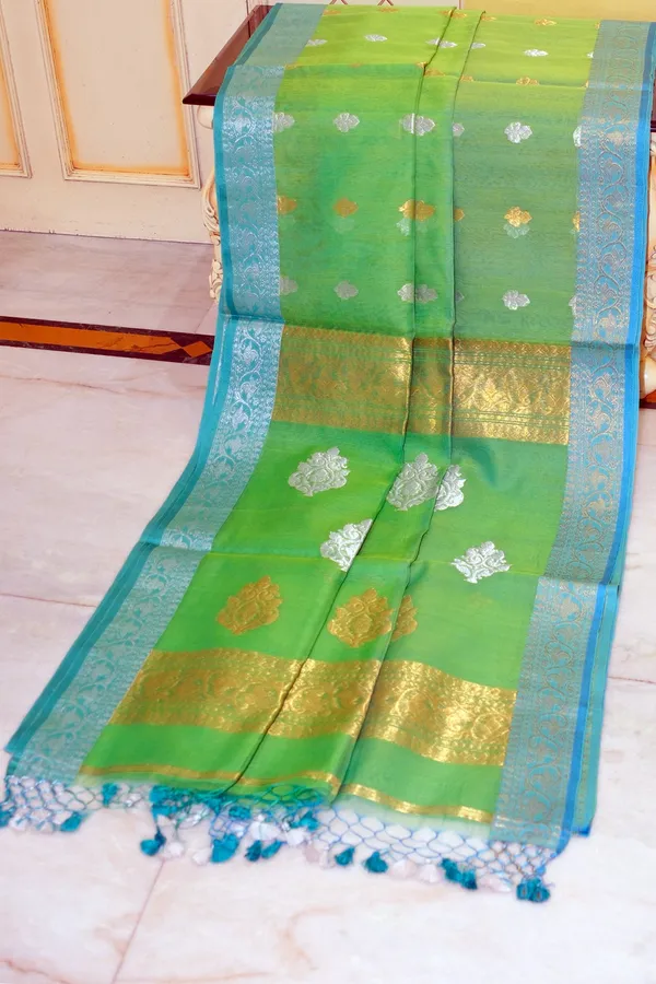 Soft_Muslin_Silk_Banarasi_Saree_In_Turtle_Green_Glacier_Blue_Golden_And_Silver_Zari_Work