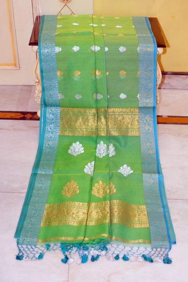 Soft_Muslin_Silk_Banarasi_Saree_In_Turtle_Green_Glacier_Blue_Golden_And_Silver_Zari_Work
