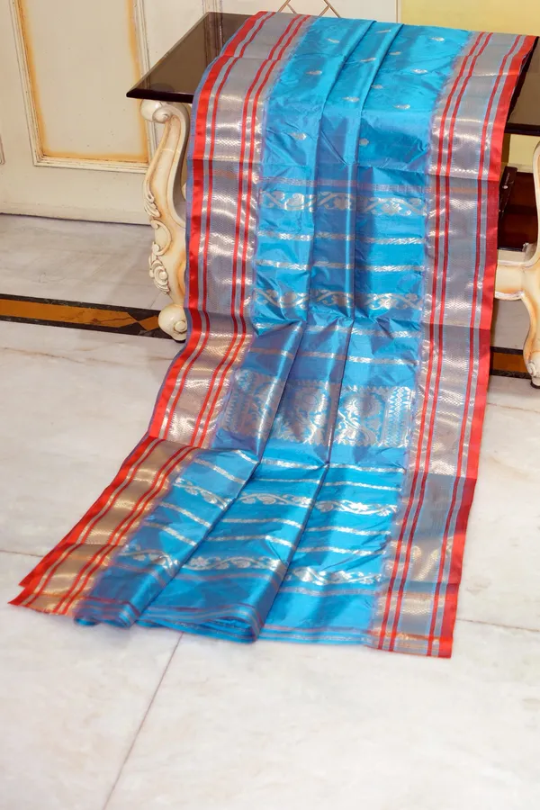 Bishnupuri_Paisely_Nakshi_Butta_Work_Pure_Katan_Silk_Saree_In_Turquoise_Blue_Portland_Orange_And_Matt_Gold