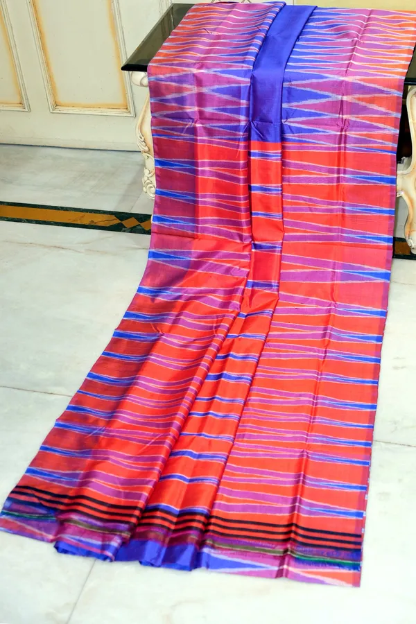 Bishnupuri_Double_Ikkat_Pure_Silk_Saree_In_Lotus_Blue_Bright_Orange_And_Off_White