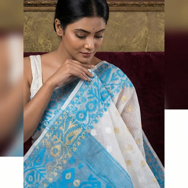 Solapuri_Self_Work_Contrast_Border_Cotton_Muslin_Jamdani_Saree_In_White_Sky_Blue_And_Gold