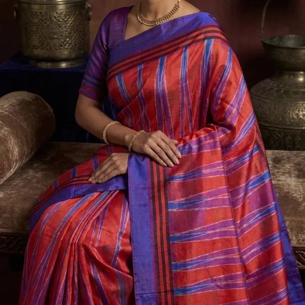 Bishnupuri_Double_Ikkat_Pure_Silk_Saree_In_Lotus_Blue_Bright_Orange_And_Off_White