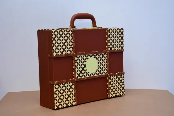 Brown_And_Golden_Handcrafted_Leather_Briefcase_With_Geometric_Pattern_And_Brass_Accents