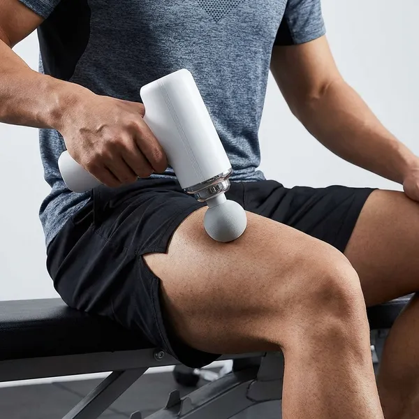 Portable_Massage_Gun_with_4_Attachments_and_Adjustable_Speed