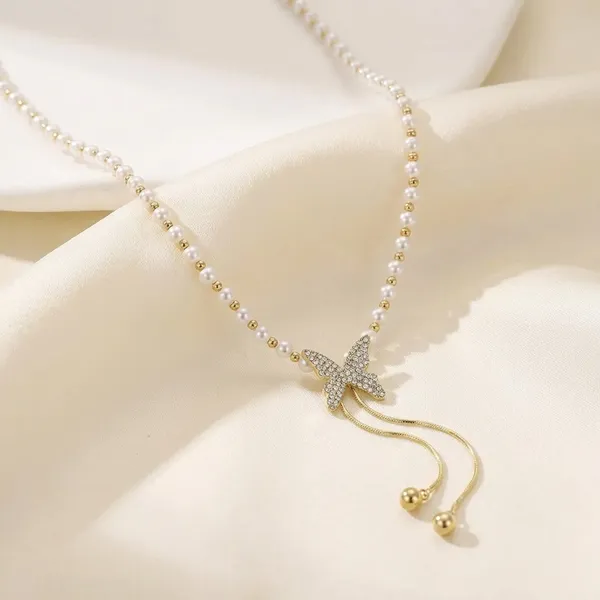 Gold_Pearl_Bow_Drop_Necklace