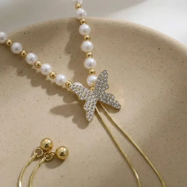 Gold_Pearl_Bow_Drop_Necklace