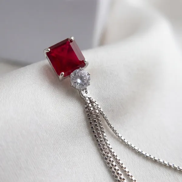 Elegant_Ruby_And_Crystal_Tassel_Earrings