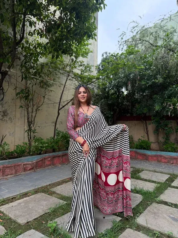 Black_and_White_Striped_Saree_with_Heavy_Printed_Red_Pallu_and_Pom-Poms