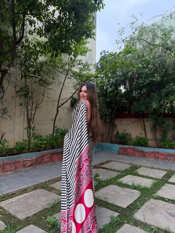 Black_and_White_Striped_Saree_with_Heavy_Printed_Red_Pallu_and_Pom-Poms