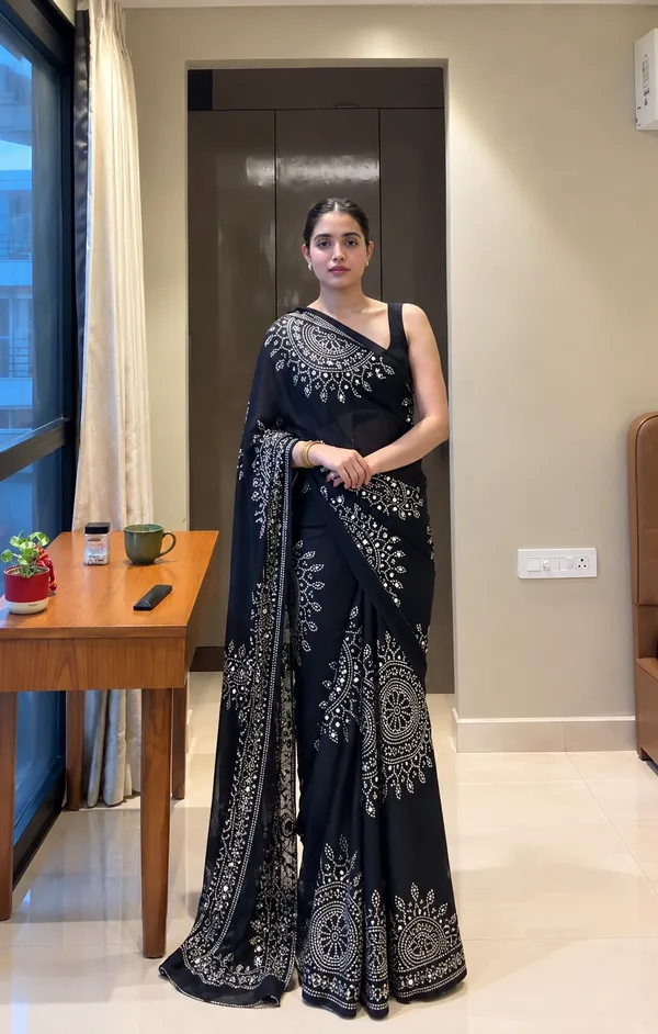 Black_saree_embellished_with_traditional_Bandhani_and_circular_motif_prints_with_real_mirror_Work