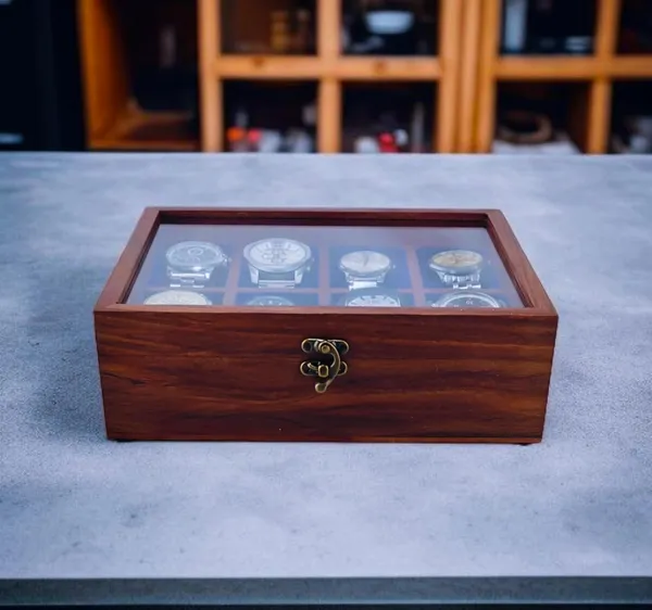 Wooden_Watch_Display_Box_With_Glass_Top_Internal_Reasoning_Protocol_The_Input_Title_Contains_Brand_Artisan_Wood_Crafts_Remove_Marketing_Fluff_Luxury_Remove_Material_Wooden_Keep_Core_To_Product_Product_Type_Watch_Display_Box_Keep_Core_Product_Quantity_Size_8_Slots_Remove_Variant_Detail_Feature_With_Glass_Top_Keep_Distinguishing_Feature_Color_Dark_Brown_Remove_Core_Product_Wooden_Watch_Display_Box_With_Glass_Top