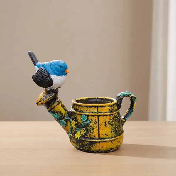 Polyresin_Bird_On_Kettle_Shape_Planter_Multicolour_Tabletop_Flower_Pot_For_Home_Decor_Balcony_Gift_Use_Mini_Resin_Plant_Holder_With_Blue_Bird_Design