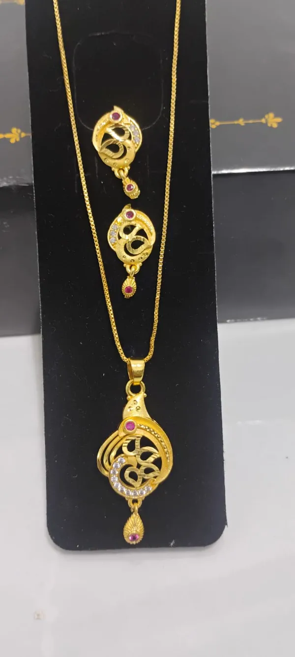 Traditional_Gold_Toned_Om_Pendant_Necklace_And_Earrings_Set_With_Purple_Stone_Accents