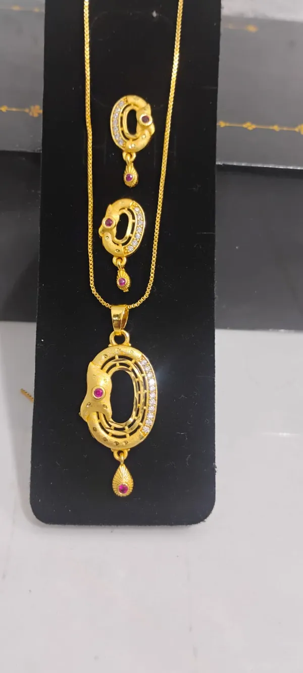 Traditional_Gold_Toned_Pendant_And_Earrings_Set_With_Ruby_Accents