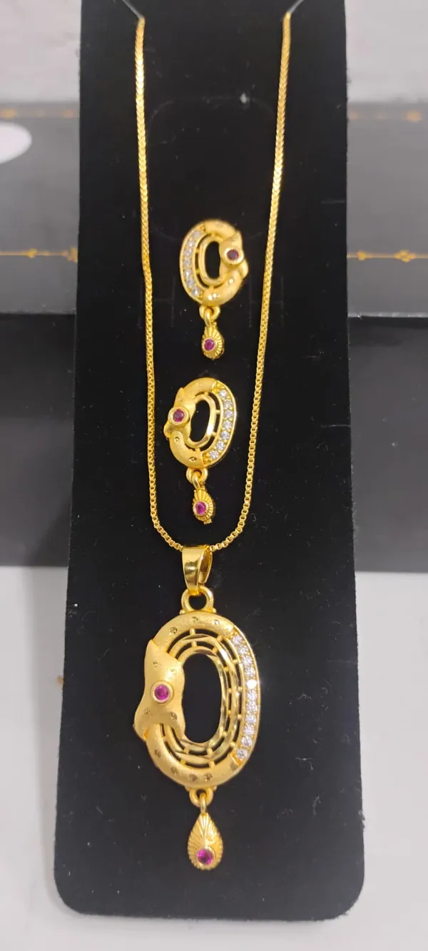 Traditional_Gold_Toned_Pendant_And_Earrings_Set_With_Ruby_Accents