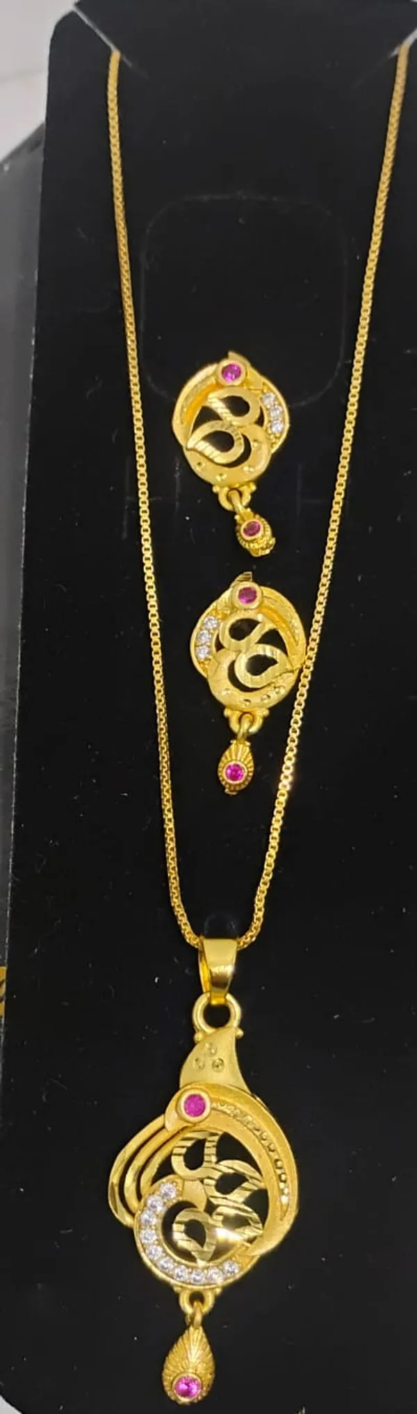 Traditional_Gold_Toned_Om_Pendant_Necklace_And_Earrings_Set_With_Purple_Stone_Accents